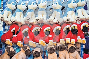 Stuffed toy dogs in Christmas theme on display awarded as wining prizes photo