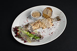 Stuffed trout with mushrooms sauce and salad