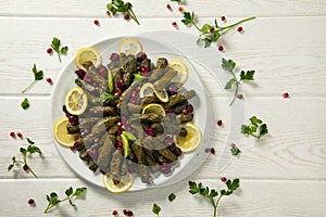 Stuffed vine leaves. Cherry and lemon leaf wrapping