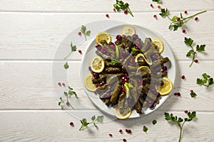 Stuffed vine leaves. Cherry and lemon leaf wrapping