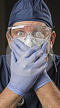 Stunned Doctor or Nurse with Protective Wear and Stethoscope