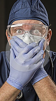 Stunned Doctor or Nurse with Protective Wear and Stethoscope photo