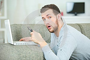 Stunned man on computer