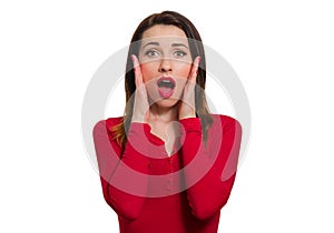 Stunned woman in red long sleeve open mouth in awe looking isolated