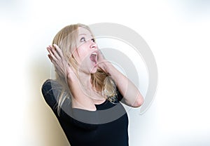 Stunned young woman on white portrait