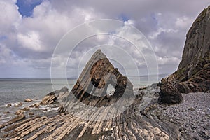 Stunning aerial drone flying landscape image of Blackchurch Rock on Devonian Geological formation