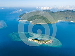 Stunning aerial high angle view of Black Island with a beautiful reef and Hook Island in the background