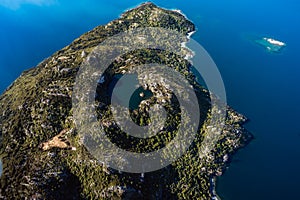 Stunning aerial image of the Arethusa Pool within Mou Waho island on Lake Wanaka taken on a sunny winter day, New Zealand