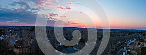 A stunning aerial panoramic shot of the blue sky with powerful red clouds at sunset