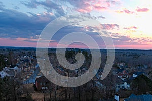 A stunning aerial shot of the blue sky with powerful red clouds at sunset