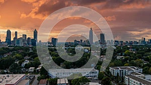 A stunning aerial shot of the cityscape at sunset with skyscrapers and office buildings in the skyline surrounded