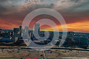 A stunning aerial shot of the skyscrapers and office buildings in the city skyline with blue sky and clouds