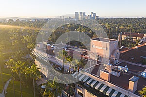 Stunning aerial view of Beverly Hills neighborhood, Beverly Hills Hotel, and Sunset Boulevard surrounded with palm trees