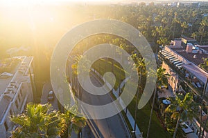 Stunning aerial view of Beverly Hills neighborhood, Beverly Hills Hotel, and Sunset Boulevard surrounded with palm trees