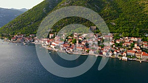 A stunning aerial view of the charming city of Perast in Montenegro, where the Bell Tower in the church of Saint