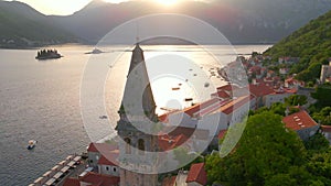A stunning aerial view of the charming city of Perast in Montenegro, where the Bell Tower in the church of Saint