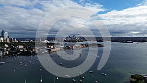 Stunning aerial view of Rushcutters Bay in Australia, featuring a cloudy sky overhead. photo