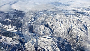 Stunning aerial view of snowy mighty mountains in Colorado. photo