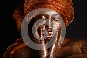 Stunning African Amercian Woman Painted With Gold photo