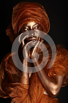 Stunning African Amercian Woman Painted With Gold photo