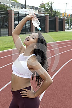 Stunning African-American fitness model on outdoor track