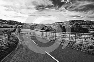 Stunning Autumn Fall black and white landscape image of wide countryside in Lake District in England