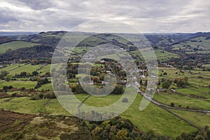 Stunning Autumn Fall landscape aerial drone image of countryside view from Curbar Edge in Peak District England at sunset