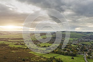 Stunning Autumn Fall landscape aerial drone image of countryside view from Curbar Edge in Peak District England at sunset