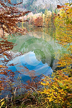 Stunning autumn landscape lake Laudachsee, at Grunberg mountain, with colorful trees