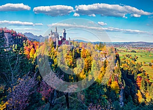 Stunning autumn scene of Neuschwanstein Castle, 19th-century hilltop fairytale castle. Bright morning scene of Bavaria. Colorful l