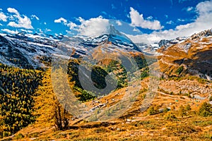 Stunning autumn scenery of famous alp peak Matterhorn from Sunnega area. Swiss Alps, Valais, Switzerland