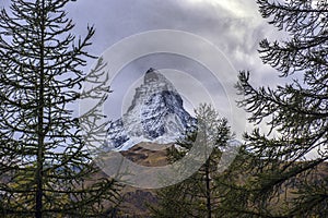 Stunning autumn scenery of famous alp peak Matterhorn. Swiss Alps, Valais