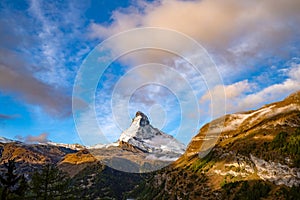 Stunning autumn scenery of famous alp peak Matterhorn. Swiss Alps, Valais, Switzerland at autumn morning