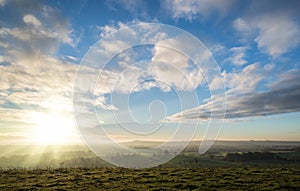 Stunning Autumn sunrise over countryside landscape