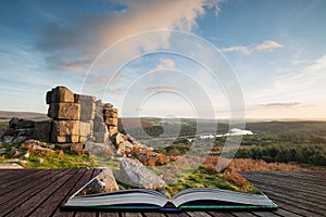 Stunning Autumn sunset landscape image of view from Leather Tor towards Burrator Reservoir in Dartmoor National Park coming out of