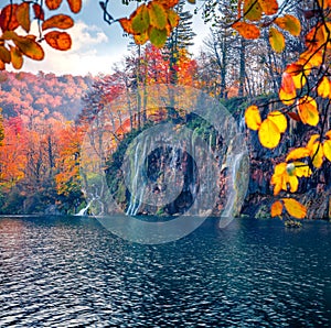 Stunning autumn view of lake and waterfall in Plitvice National Park.