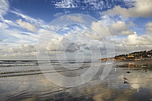 Stunning beach landscape of the sea on a cloudy day with copy space. Calm waves at the shore on a quiet coastline with