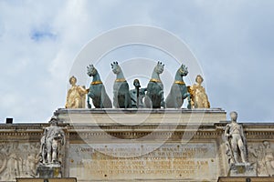 Stunning and beautiful statues on top of the Arc de Triomphe du Carrousel in Paris, France