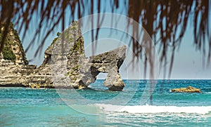 Stunning beautiful tropical island paradise landscape shot under beach straw umbrella panorama view of rocks on an amazing turquoi