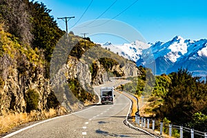 Stunning beautiful view of the road with alps mountain. Noon scenery with some cloudy and blue sky. nature scene in the
