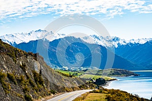 Stunning beautiful view of the road beside Lake Wanaka with alps mountain. Noon scenery with some cloudy and blue sky. nature