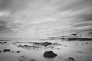 Stunning black and white long exposure landscape image of low ti