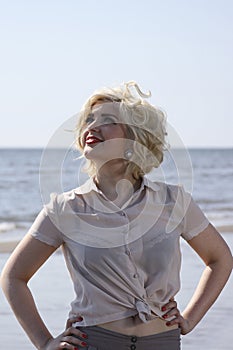 Stunning blonde haired teenage girl at the beach