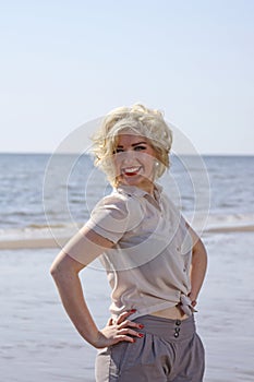 Stunning blonde haired teenage girl at the beach