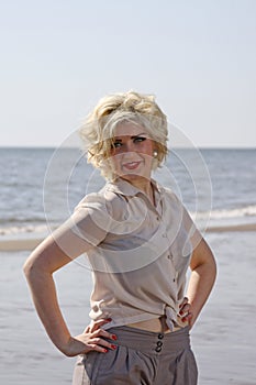 Stunning blonde haired teenage girl at the beach