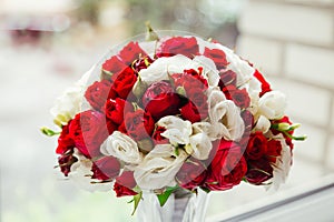 Stunning bouquet made of dark red and white roses