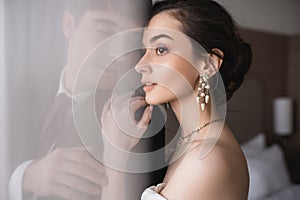 stunning bride in elegant jewelry and