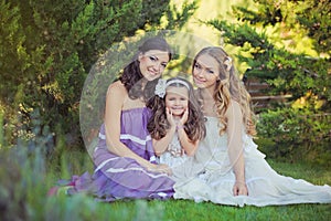 Stunning Brunette blond chestnut blue eyes sisters girls wearing stylish white purple dress enjoying life time together summer sun photo