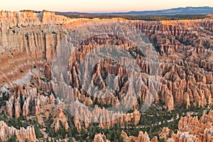 The stunning Bryce Canyon in all its glory at sunrise, amazing limetstone hoodoo with various shades of oranges and reds