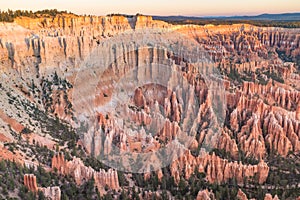 The stunning Bryce Canyon bowl in all its glory at sunrise, amazing limestone hoodoo with various shades of oranges and reds